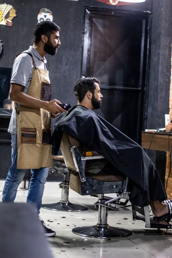 Barber at work cutting a client's hair